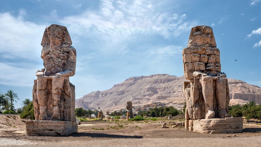 shutterstock_2076152947-The-Colossi-of-Memnon-two-massive-stone-statues-of-Pharaoh-Amenhotep-III-c-Kalvan-950.jpg