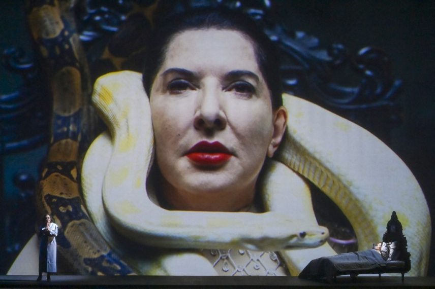 Serbian performer Marina Abramovic performs during the production "7 seven deaths of Maria Callas" at the Greek National Opera in Athens, on September 23, 2021. - Abramovic, "fascinated by the personality, life and even death" of Maria Callas, "wanted to replay" at the Greek National Opera, "seven deaths" that the soprano had experienced on scene before her. Because "like many of the opera heroines she created on stage, she too died of love. She died of a broken heart," the Serbian artist told AFP. (Photo by ARIS MESSINIS / AFP)