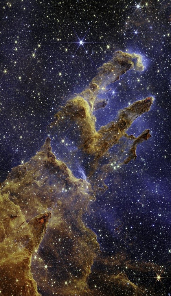 This handout photo provided by NASA on October 19, 2022 shows the Pillars of Creation that are set off in a kaleidoscope of color in NASAs James Webb Space Telescopes near-infrared-light view. - The pillars look like arches and spires rising out of a desert landscape, but are filled with semi-transparent gas and dust, and ever changing. This is a region where young stars are forming  or have barely burst from their dusty cocoons as they continue to form. (Photo by Handout / NASA/ESA/CSA / AFP) / RESTRICTED TO EDITORIAL USE - MANDATORY CREDIT "AFP PHOTO / NASA/ESA/CSA " - NO MARKETING NO ADVERTISING CAMPAIGNS - DISTRIBUTED AS A SERVICE TO CLIENTS