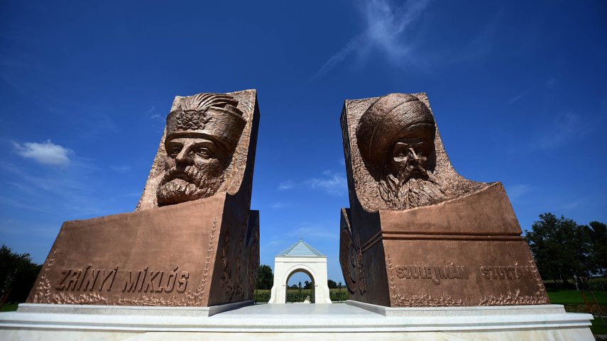 Statues of rival military leaders of 16th century, Ottoman Sultan Suleiman (R) and his opponent Miklos Zrinyi (L), are seen at the Hungarian-Turkish friendship park near Szigetvar on September 2, 2016 after the relic of the sultan was found outside Szigetvar last year. The recent discovery of the tomb of Suleiman the Magnificent, considered the greatest Ottoman ruler, has raised hopes of a tourism boom in one of Hungary's most impoverished areas. Experts confirmed in July that excavations begun two years ago in the struggling town of Szigetvar, close to the Croatian border, had revealed the tomb of the 16th-century ruler. Suleiman died aged 71 on September 7, 1566, during an epic battle with the mainly Croatian defenders of Szigetvar castle that depleted his forces hoping to quickly advance on Vienna, the capital of the Habsburg Empire. (Photo by ATTILA KISBENEDEK / AFP)