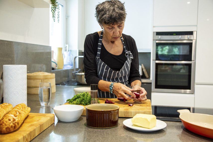 A woman prepares food in her modern kitchen
Grant Squibb / Connect Images / Connect Images via AFP