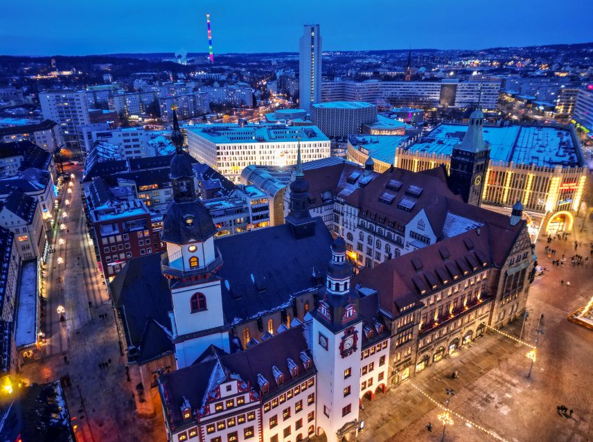 PRODUCTION - 04 January 2025, Saxony, Chemnitz: The towers of St. Jacob's Church (l-r), the Old Town Hall and the New Town Hall dominate the market square in the city centre (aerial view with a drone). On January 18, the city rings in the year as European Capital of Culture with a big celebration. Around 80,000 visitors are expected in the city center. After years of preparation, the city is now European Capital of Culture together with Nova Gorica in Slovenia. Photo: Hendrik Schmidt/dpa (Photo by HENDRIK SCHMIDT / DPA / dpa Picture-Alliance via AFP)