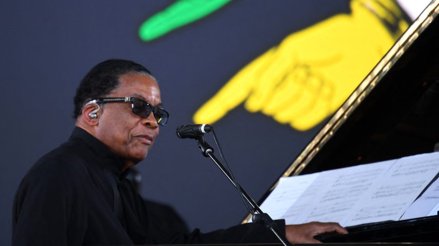 US musician Herbie Hancock performs on the Pyramid Stage at the Glastonbury festival near the village of Pilton in Somerset, south-west England, on June 26, 2022. More than 200,000 music fans descend on the English countryside this week as Glastonbury Festival returns after a three-year hiatus. The coronavirus pandemic forced organisers to cancel the last two years' events, and those going this year face an arduous journey battling three days of major rail strikes across the country. (Photo by ANDY BUCHANAN / AFP)